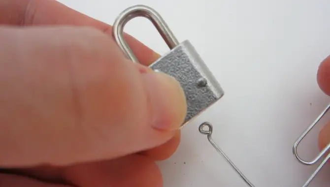 Insert A Paperclip Into The Small Hole On Top Of The Lock