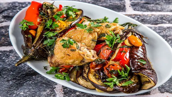 Roasted Chicken Thighs With Tandoori Aubergine And Tomato Salad