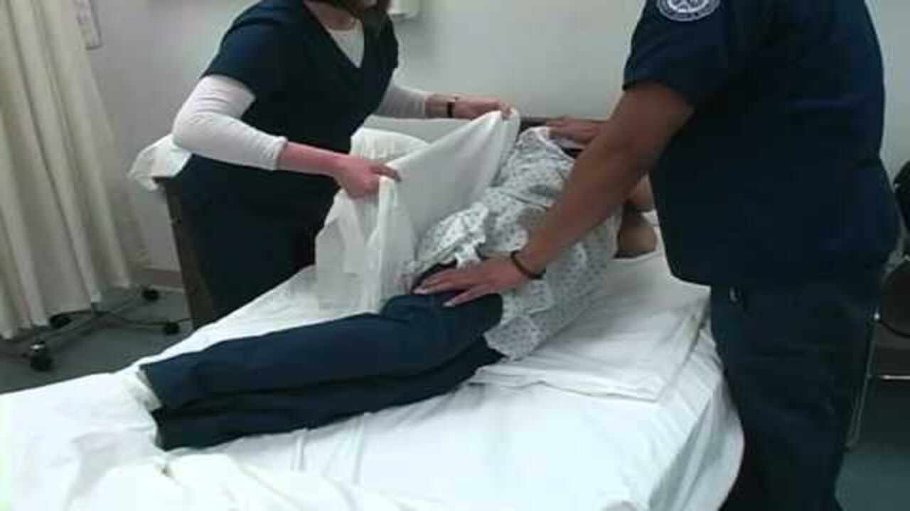 Gently Roll The Patient To One Side